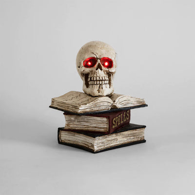 Calavera Sobre Libros con Luz Frank and Mortis